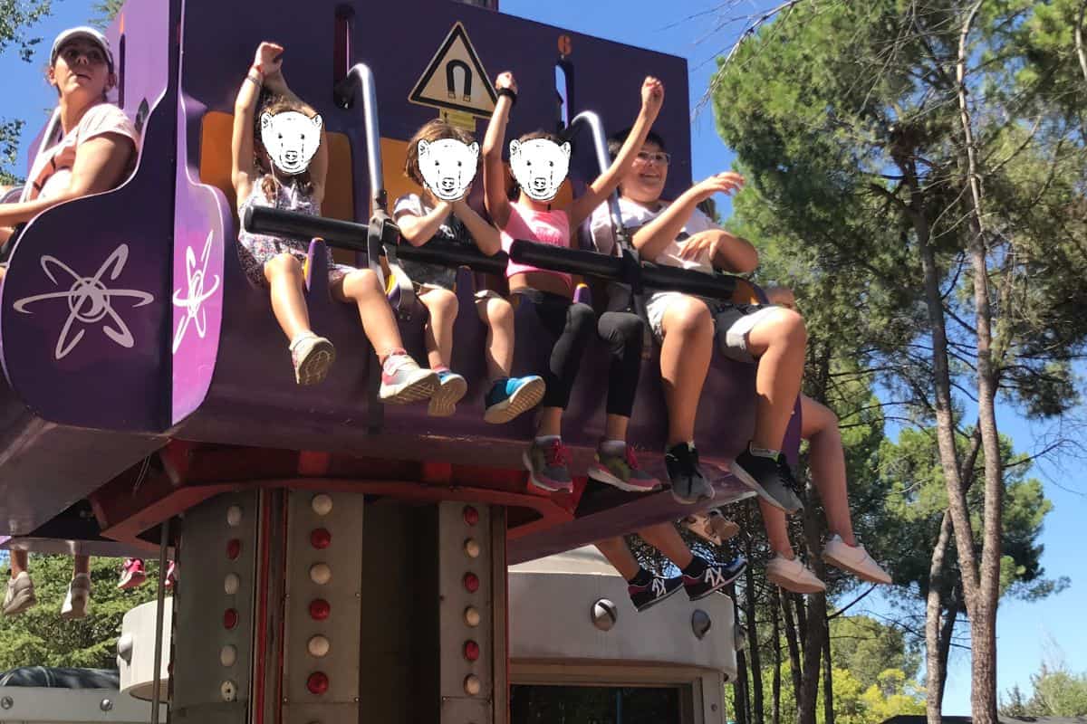 Kids on a ride at the amusement park in Madrid