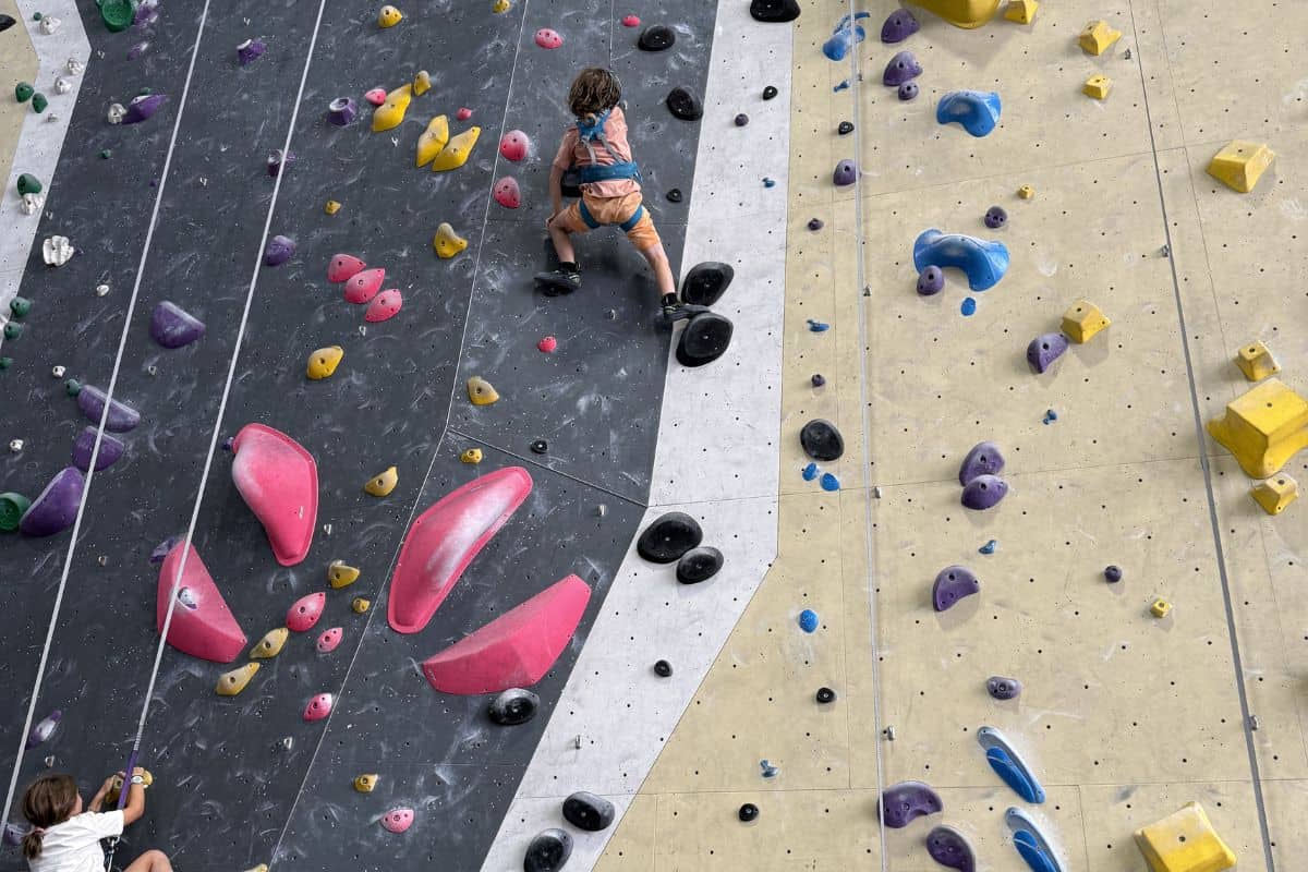 Boy rock climbing at Sharma in Madrid